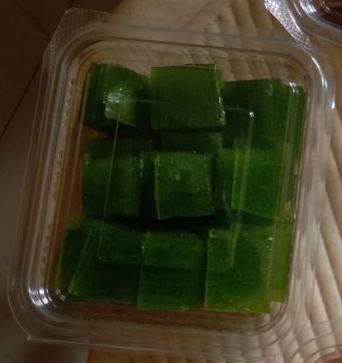 Green raw mango (kairi) bar pieces in a box